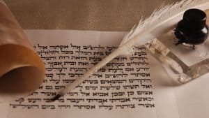 Pen and scroll with hebrew text
